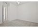 Bright bedroom with neutral carpet and a modern ceiling light at 6239 Woodhaven Village Dr, Port Orange, FL 32128