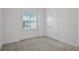 Cozy bedroom features natural light and a closet for storage at 6239 Woodhaven Village Dr, Port Orange, FL 32128