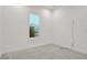 A bright bedroom with neutral carpet and a large window bringing in natural light at 6239 Woodhaven Village Dr, Port Orange, FL 32128
