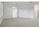 Spacious bedroom with carpet flooring, multiple doors, and neutral color scheme at 6239 Woodhaven Village Dr, Port Orange, FL 32128