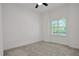 Minimalist bedroom with window providing ample natural light at 6239 Woodhaven Village Dr, Port Orange, FL 32128