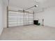 Spacious two-car garage with an automatic garage door and lots of room at 6239 Woodhaven Village Dr, Port Orange, FL 32128