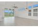 Bright living room with large sliding glass doors providing ample natural light and backyard views at 6239 Woodhaven Village Dr, Port Orange, FL 32128