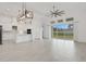 Open-concept living space with kitchen, living, and dining areas, ideal for entertaining at 6239 Woodhaven Village Dr, Port Orange, FL 32128