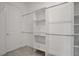 Large walk-in closet with shelving and racks for maximum storage at 6239 Woodhaven Village Dr, Port Orange, FL 32128