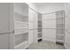 Spacious walk-in closet provides ample storage with custom shelving and drawers at 6239 Woodhaven Village Dr, Port Orange, FL 32128