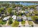 Aerial view of the house, showcasing the surrounding neighborhood and waterfront access at 705 Baffie Ave, Winter Park, FL 32789