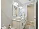 Bright bathroom featuring double sink vanity with square sinks and modern fixtures at 705 Baffie Ave, Winter Park, FL 32789