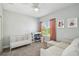 Bright bedroom with natural light and comfortable seating at 705 Baffie Ave, Winter Park, FL 32789