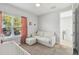 Bright bedroom with natural light and comfortable seating at 705 Baffie Ave, Winter Park, FL 32789