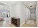 Upstairs hallway featuring hardwood floors, neutral walls, and access to bedrooms and bathrooms at 705 Baffie Ave, Winter Park, FL 32789