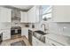 Modern kitchen featuring stainless steel appliances, white cabinets, a subway tile backsplash, and an apron sink at 705 Baffie Ave, Winter Park, FL 32789
