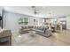 Open-concept living space featuring a large sofa, dining area, and kitchen, perfect for entertaining at 705 Baffie Ave, Winter Park, FL 32789