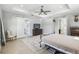 Spacious main bedroom with hardwood floors, access to an ensuite bathroom, and neutral decor at 705 Baffie Ave, Winter Park, FL 32789