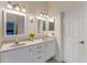 Well-lit bathroom featuring double sinks, granite countertops, and modern lighting fixtures at 782 Seneca Meadows Rd, Winter Springs, FL 32708