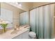 Bathroom with single vanity, toilet, and shower curtain at 782 Seneca Meadows Rd, Winter Springs, FL 32708