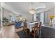 Open-concept dining room with modern chandelier, seamlessly flowing into the living area and kitchen at 782 Seneca Meadows Rd, Winter Springs, FL 32708