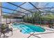 Relaxing screened-in pool and spa area with outdoor seating, perfect for enjoying the Florida sunshine at 782 Seneca Meadows Rd, Winter Springs, FL 32708