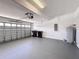 Clean garage with ample storage space, featuring a garage door, water heater, and electrical panel at 910 Suffolk Pl, Davenport, FL 33896