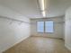 Spacious walk-in closet with tiled floor and white wire shelving at 910 Suffolk Pl, Davenport, FL 33896