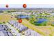 Aerial view of the townhome community near schools and a pond at 9743 Amber Chestnut Way, Winter Garden, FL 34787