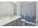 A full bathroom featuring a vanity with a sink, a toilet and a tub and shower combination at 9743 Amber Chestnut Way, Winter Garden, FL 34787