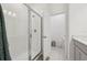 A bright bathroom with a glass-enclosed shower and a separate toilet room at 9743 Amber Chestnut Way, Winter Garden, FL 34787