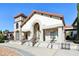 Grand clubhouse exterior with stone accents, arched entrance, and tile roof provides a welcoming atmosphere at 9743 Amber Chestnut Way, Winter Garden, FL 34787