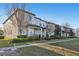 Exterior view of well-maintained townhomes with manicured lawns, sidewalks, and common areas at 9743 Amber Chestnut Way, Winter Garden, FL 34787