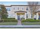 Charming townhome with a well-maintained front yard and a cozy porch area at 9743 Amber Chestnut Way, Winter Garden, FL 34787
