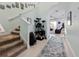 Bright foyer with staircase and view of the living area beyond at 9743 Amber Chestnut Way, Winter Garden, FL 34787