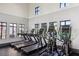 Bright and airy gym with treadmills, elliptical machines, and large windows for an invigorating workout at 9743 Amber Chestnut Way, Winter Garden, FL 34787