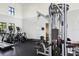 Well-equipped gym features treadmills, weight machines, and rubber flooring for a complete fitness experience at 9743 Amber Chestnut Way, Winter Garden, FL 34787