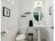 Cozy half-bathroom with modern vanity, decorative shelves, and modern fixtures at 9743 Amber Chestnut Way, Winter Garden, FL 34787