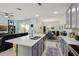 Bright open concept kitchen and dining area offers modern finishes and stainless appliances, a seamless living space at 9743 Amber Chestnut Way, Winter Garden, FL 34787