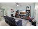 Relaxing living room featuring comfortable seating and entertainment center at 9743 Amber Chestnut Way, Winter Garden, FL 34787