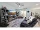 Open-concept living room with stylish decor, adjacent to the dining area at 9743 Amber Chestnut Way, Winter Garden, FL 34787