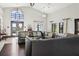 Stylish clubhouse lounge features modern furnishings, a cozy atmosphere, and large windows at 9743 Amber Chestnut Way, Winter Garden, FL 34787