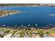 Aerial view of lakefront properties with private docks and a view of the lake at 10116 Pointview Ct, Orlando, FL 32836