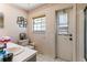 Bathroom with single sink vanity, toilet and a door to the outside of the home at 10116 Pointview Ct, Orlando, FL 32836