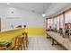 Charming breakfast nook with tile floors and bar seating, perfect for enjoying a quick meal or morning coffee at 10116 Pointview Ct, Orlando, FL 32836