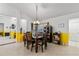 Cozy dining area featuring stylish lighting, tile floors, and ample space for entertaining guests at 10116 Pointview Ct, Orlando, FL 32836