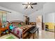 View of the main bedroom with tiled floors and comfortable furnishings at 10116 Pointview Ct, Orlando, FL 32836