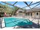 Relaxing screened-in pool area with patio and exterior view of the home, perfect for outdoor entertaining at 10116 Pointview Ct, Orlando, FL 32836