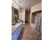 Bright bathroom with dual sinks and a shower-tub combination at 102 Vista Verdi Cir # 220, Lake Mary, FL 32746