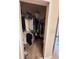 Walk-in closet with clothes hanging on rods and some items on the floor at 102 Vista Verdi Cir # 220, Lake Mary, FL 32746