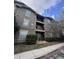 Multi-story condo building with balconies and well-maintained landscaping at 102 Vista Verdi Cir # 220, Lake Mary, FL 32746