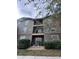 Multi-level condo building with balcony access and lush green landscaping at 102 Vista Verdi Cir # 220, Lake Mary, FL 32746