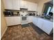 Functional kitchen equipped with white cabinets and essential appliances at 102 Vista Verdi Cir # 220, Lake Mary, FL 32746