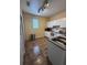 Bright kitchen featuring modern white appliances and tile flooring at 102 Vista Verdi Cir # 220, Lake Mary, FL 32746